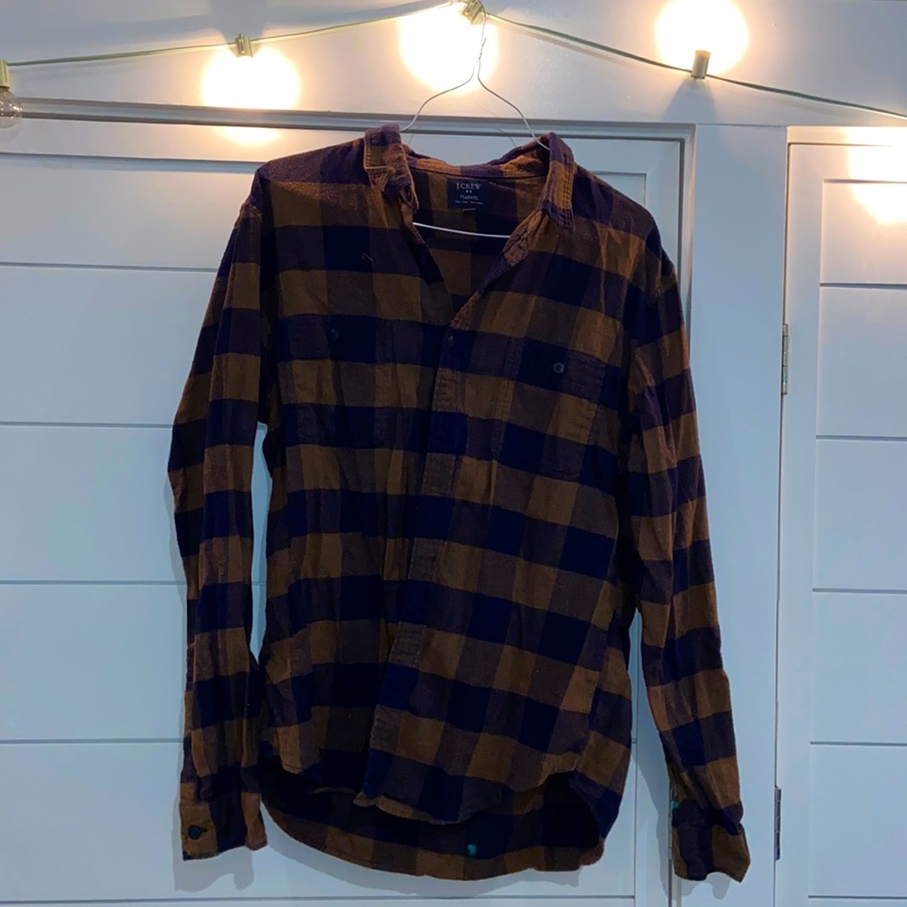 Black and brown flannel from J Crew. Men’s large.
